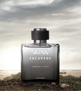 A Skinn Escapade Country Khad perfume bottle displayed on a beach background.